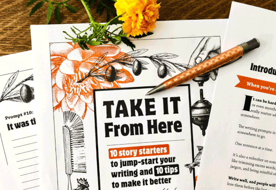 Take It From Here workbook pages with pen and marigold on desk