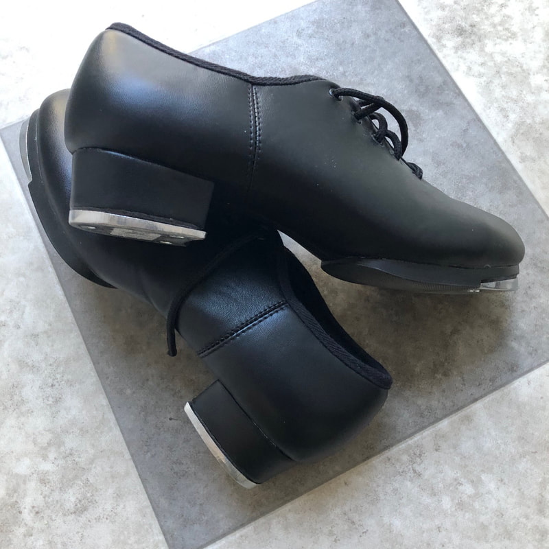 photograph of black tap shoes 