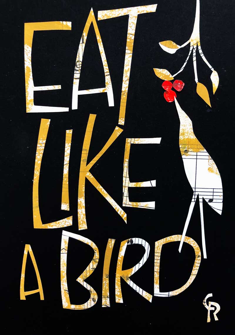 collage on black paper: words, Eat like a bird with a bird reaching up to eat berries from a branch